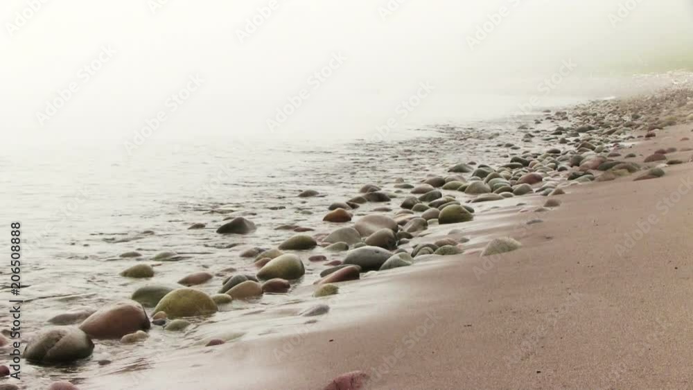 The fog floats on the rocky shore of the sea The fog floats on the rocky shore of the sea