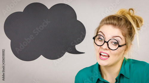 Confident rude business woman with thinking bubble