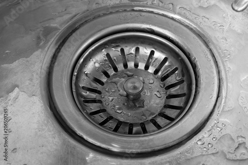 Drain hole close-up in the metal sink