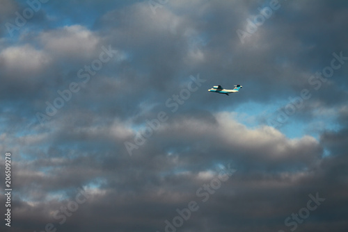 Plane in cloudy sky. Sheremetyevo, Moscow, Russia