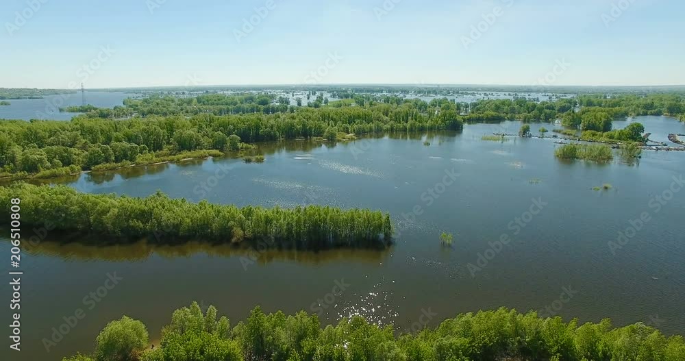 Aerial video of a big lake and a flooded river. Drone moving forward. Aerial stock footage shot at summer season time. Aerial video of a big lake and a flooded river. Drone moving forward. Aerial stock footage shot at summer season time.