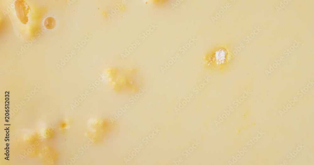 Top close view of fresh creamy homemade banana cream pudding with bubbles popping after mixing. Top close view of fresh creamy homemade banana cream pudding with bubbles popping after mixing.