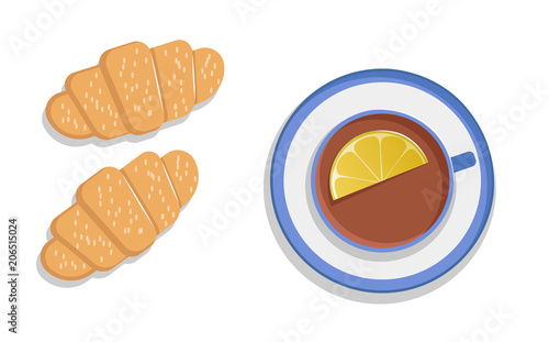 Tea with lemon and croissants