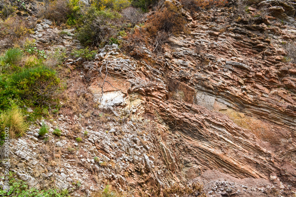 Texture of the rock. Large rocks exfoliate from the rock. Texture of the rock. Large rocks exfoliate from the rock.