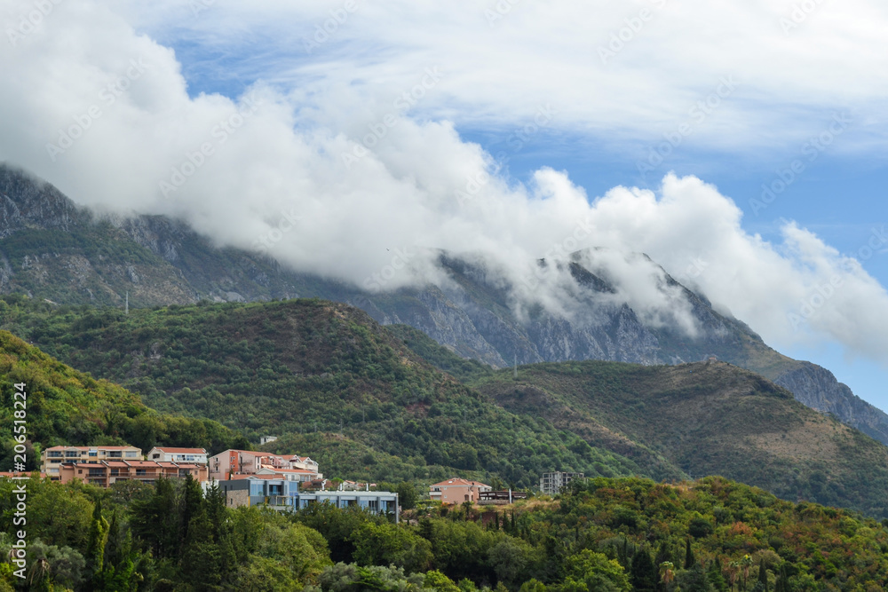 Becici, Montenegro, View of the city and mountains. Mountains above the clouds