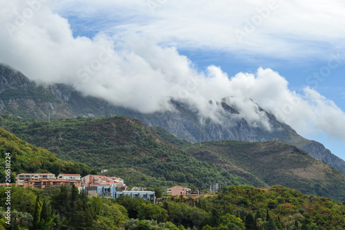 Becici, Montenegro, View of the city and mountains. Mountains above the clouds