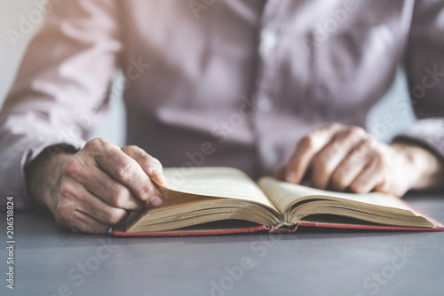 Man reading book on the table