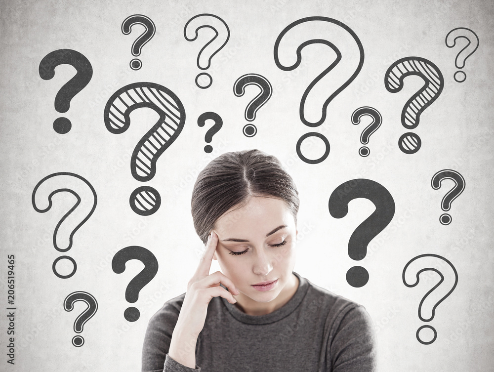Stressed young woman with headache, question marks Stressed young woman with headache, question marks