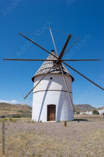 Windmill under blue sky in Almeria, Andalucia