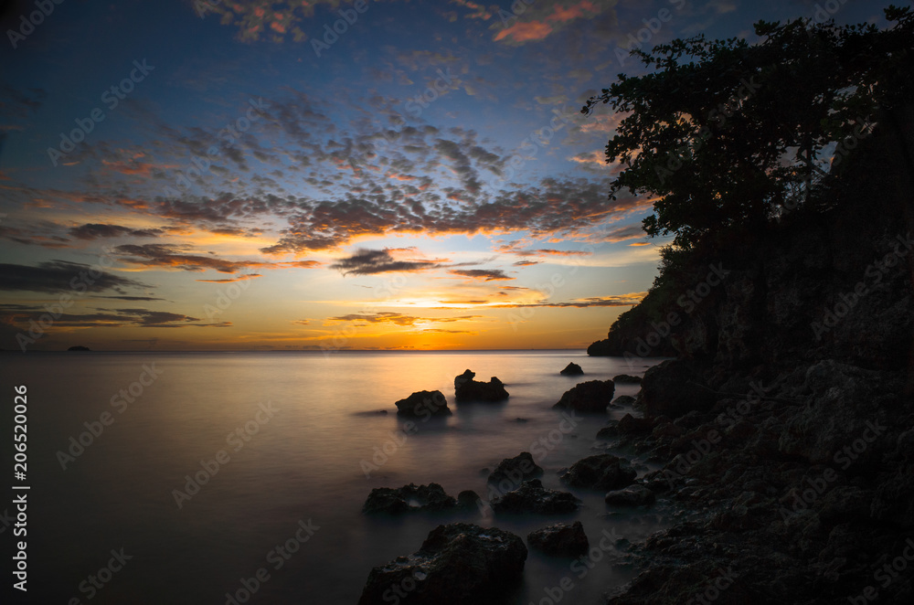 Rocky Island Beach With Silky Smooth Sea - Philippines