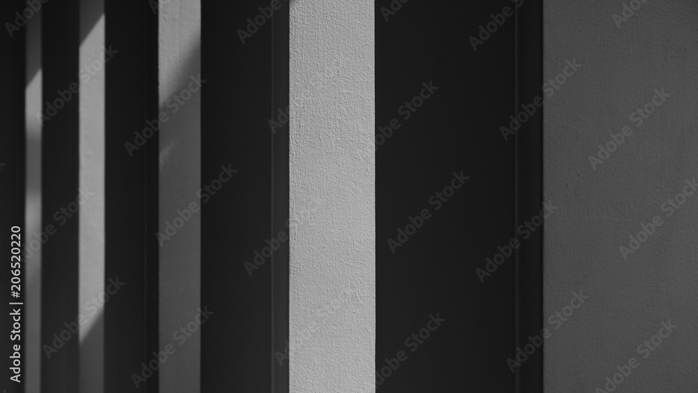 Abstract background of a white wall with shadows from the window. - monochrome