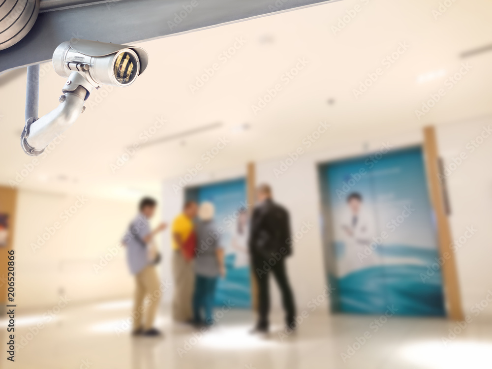 Fototapeta premium security camera surveillance installed on ceiling to monitor