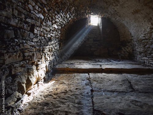 Rays of light shinning into the old cellar 