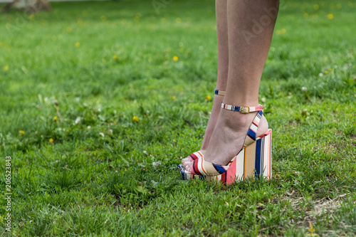 Legs of woman wearing high heel shoes