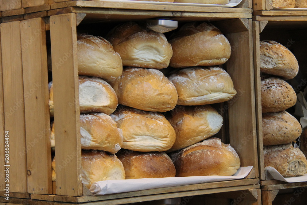 Wooden Boxes Displaying Freshly Baked Bread Loaves.