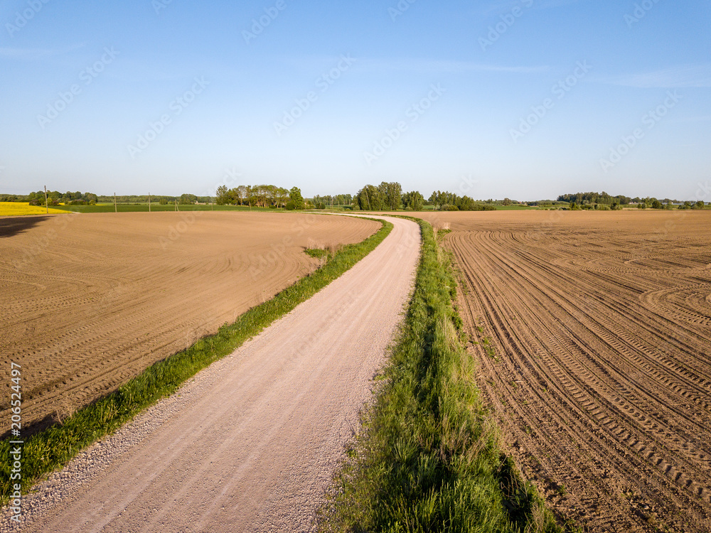 Naklejka premium drone image. aerial view of rural area with cultivated fields of rape seed