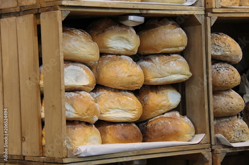 Wooden Boxes Displaying Freshly Baked Bread Loaves.