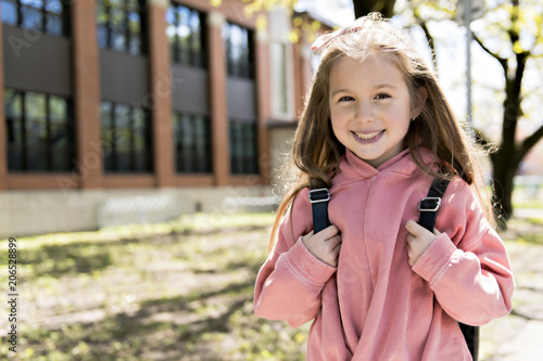 Wallpaper Mural Portrait of cute girl with backpack outside of school Torontodigital.ca