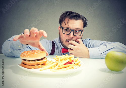 Chunky man craving for fast food