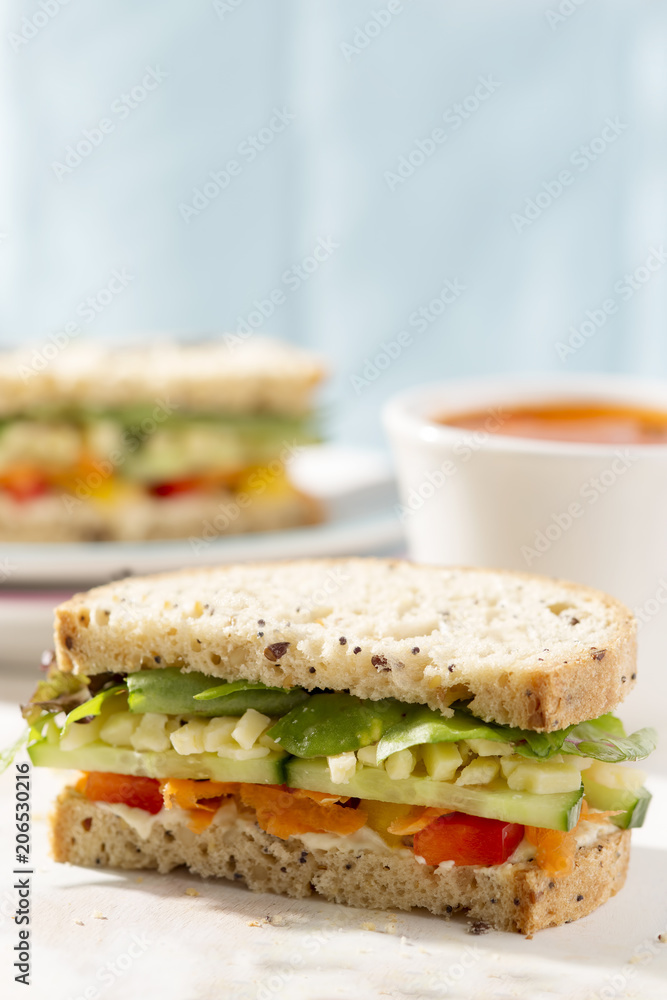 Wholemeal sandwich with mixed leaves, cucumber, carrot, peppers and cheddar cheese with hummus Wholemeal sandwich with mixed leaves, cucumber, carrot, peppers and cheddar cheese with hummus