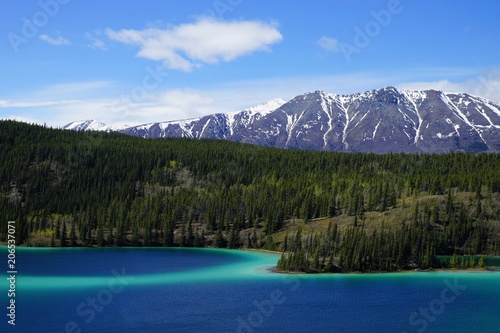 Emerald Lake, Yukon, Canada with mountains and forest on the background