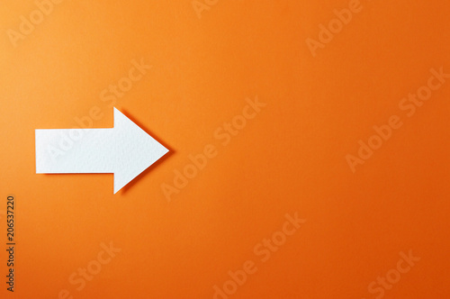 one solid arrow on orange background