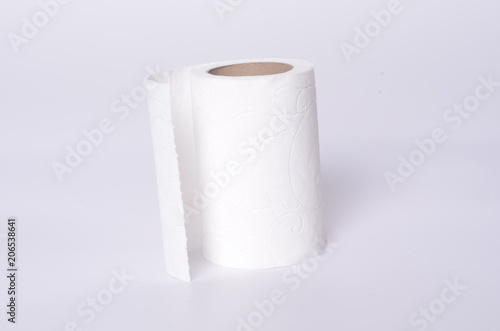 Simple toilet paper on white background photo