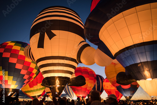Hot air balloon lit up against the night sky in Albuquerque, New Mexico. 