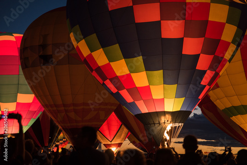 Hot air balloon lit up against the night sky in Albuquerque, New Mexico. 