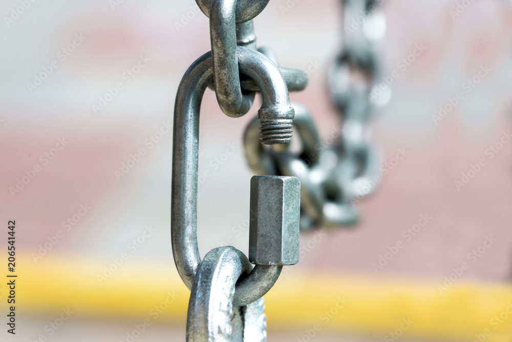Iron chain on a white background. Close-up. Iron chain on a white background. Close-up.