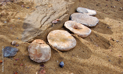 Close up of five anizasi grindstone's in the Bisti Badlands of North West New Mexico. photo