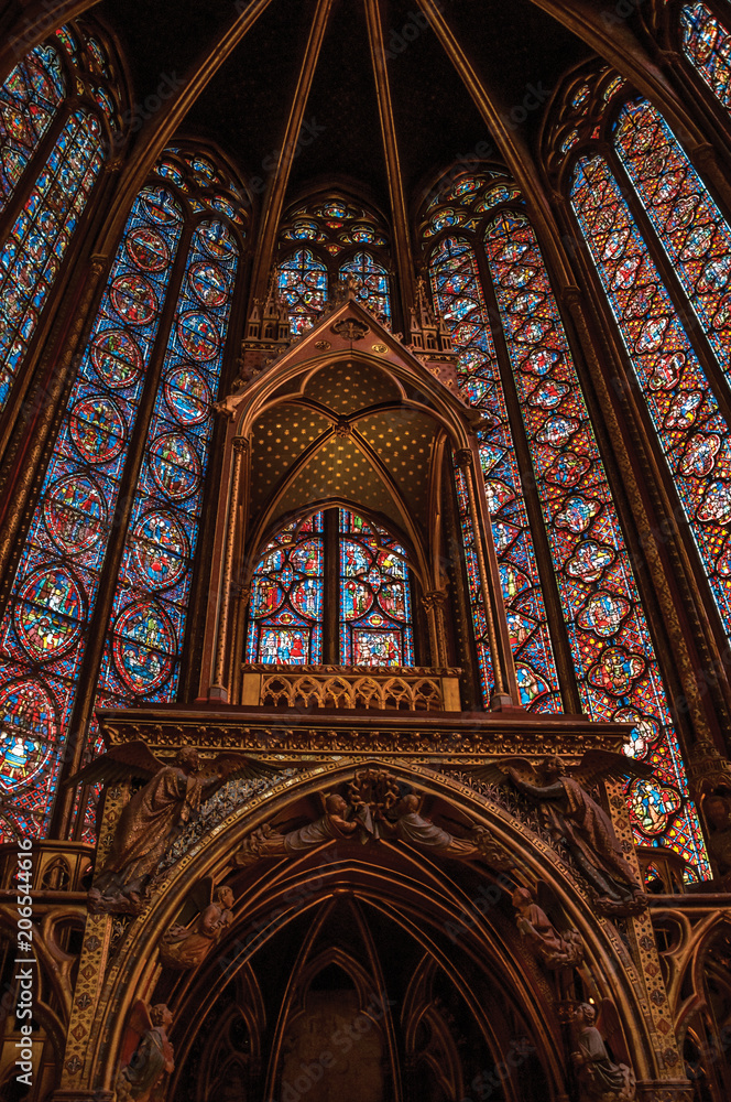 Stained glass windows and baldachin at the Sainte-Chapelle (church) in Paris. Known as the “City of Light”, is one of the most awesome world’s cultural center. Northern France.