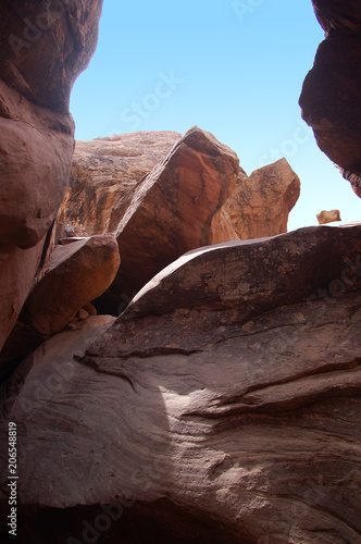 Boulder strewn redrock clifflside in the Bears Ears wilderness of the Southern Utah desert