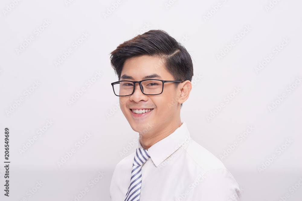 Handsome young asian business man smiling