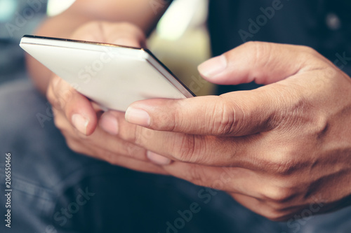 Using Smart Phone, Closeup of man hands holding and touching a smartphone