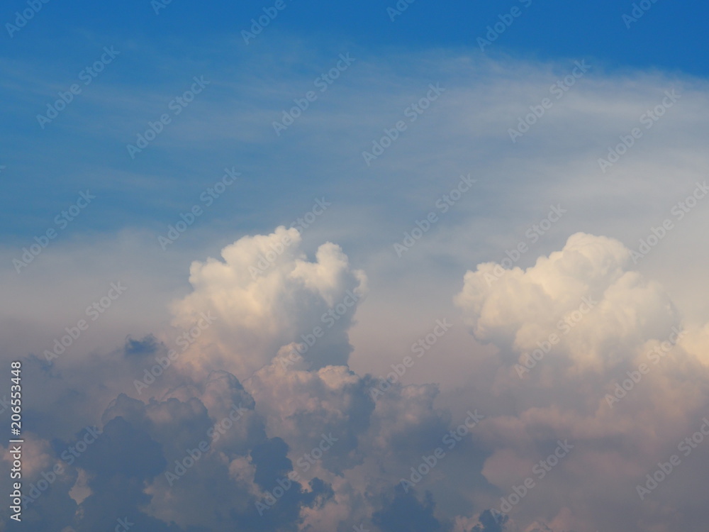 Blue sky and white clouds. It is beautiful and bright in summer. The moment of happiness and freedom is heaven. Blue sky and white clouds. It is beautiful and bright in summer. The moment of happiness and freedom is heaven.