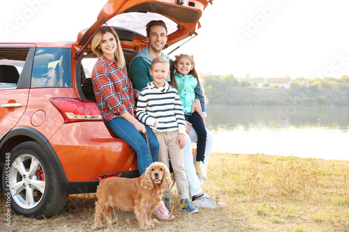 Young family with cute chil...