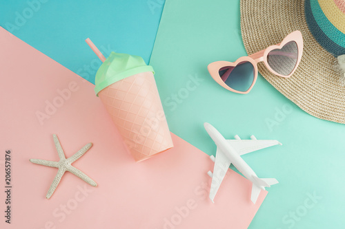 Women's accessories items on pastel colors background, Summer vacation concept photo
