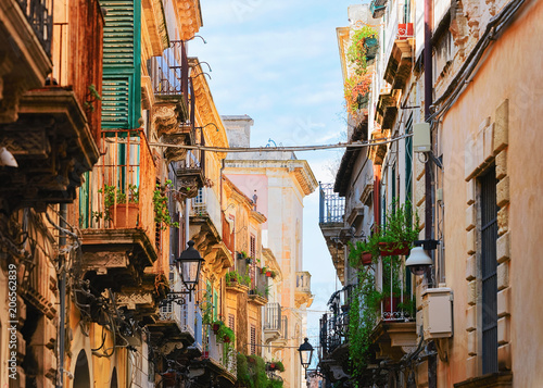 Narrow ancient street in Siracusa Sicily © Roman Babakin