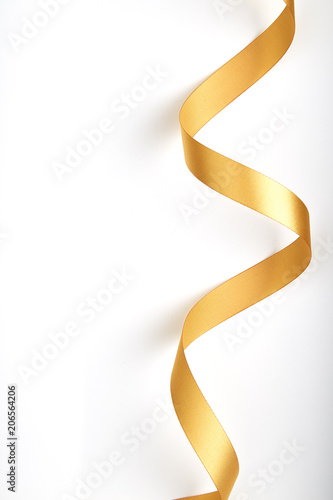 Gold ribbon on a white background.