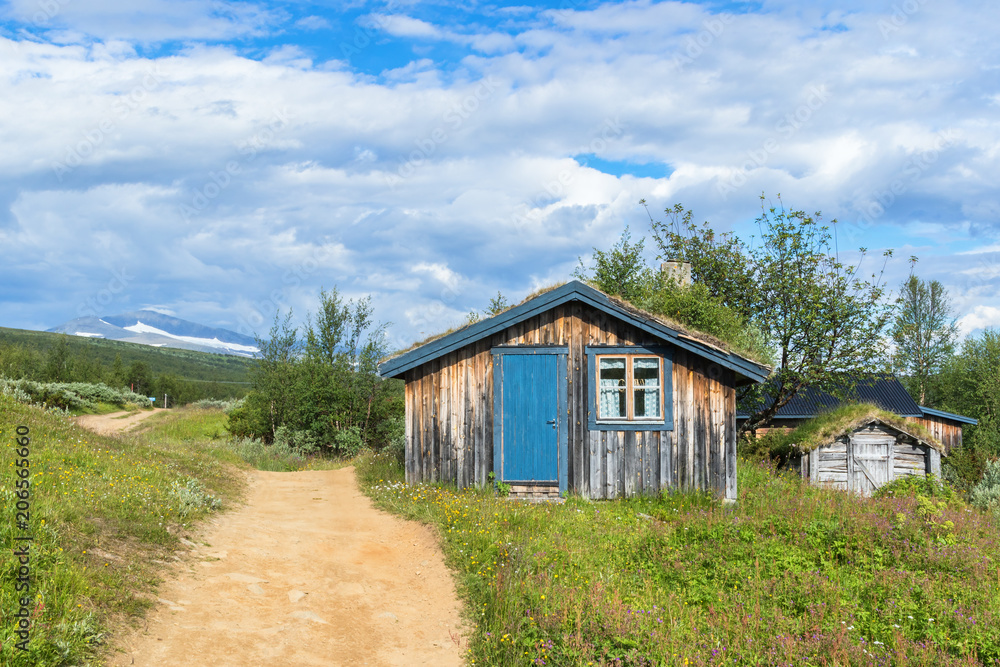 Mountain hut at a path in the swedish mountains Mountain hut at a path in the swedish mountains