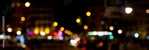 Bokeh traffic light at night in the street of a big city