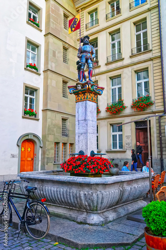 Banneret fountain on Rathausplatz in Bern evening photo