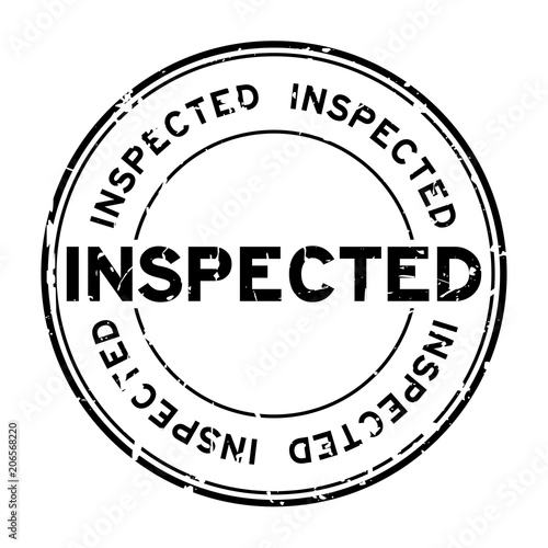Grunge black inspected word round rubber seal stamp on white background