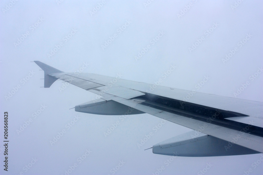 Fototapeta premium Wing of an airplane in the sky