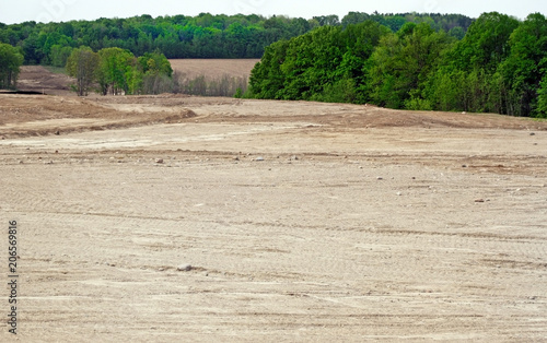 Deforestation of trees and acres of land leveled and graded to make way for a new subdivision