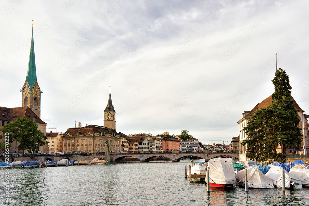 Fraumunster Church and St Peter and boats Limmat Zurich