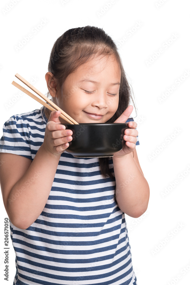 Asian child girl age 7 year , eating Instant noodles on white background Asian child girl age 7 year , eating Instant noodles on white background