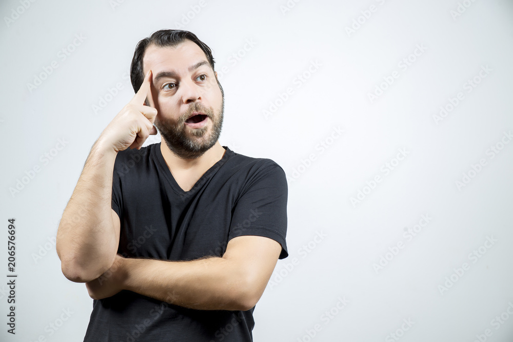 Adult man hit on a good idea and astonishedly looking to the right side Adult man hit on a good idea and astonishedly looking to the right side