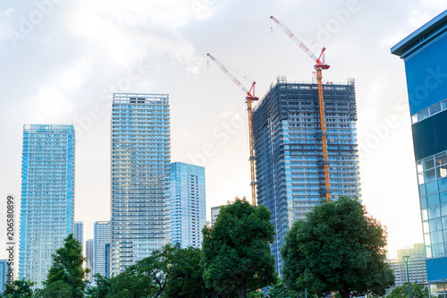 Photography Tower mansion and building under construction against evening sky